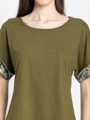 Detail view of olive green Riya jersey t-shirt showing soft fabric texture and scoop neckline construction quality