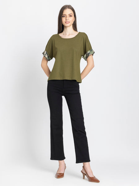 Olive green Riya t-shirt styled casually with black pants comfortable scoop neck jersey top outfit inspiration