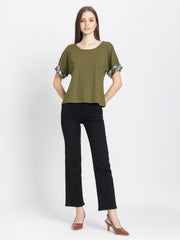 Olive green Riya t-shirt styled casually with black pants comfortable scoop neck jersey top outfit inspiration