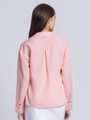 Back view of peach Tamara party shirt featuring inverted pleats and concealed button placket in breathable poly linen