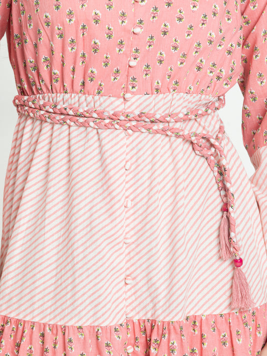 Close-up of elasticated waist with belt on pink cotton dress