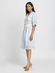 Left side view of light blue Poetry cotton dress showing short flared sleeves and straight hem