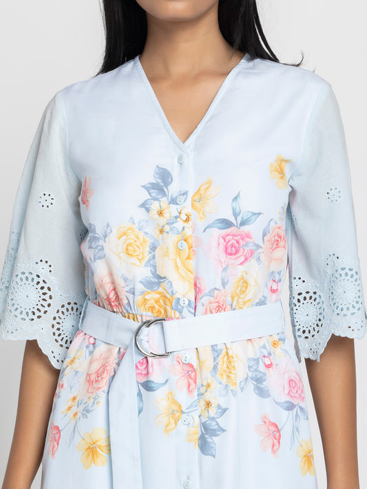 Close-up of floral print and Schiffli embroidery at hem on light blue Poetry cotton dress