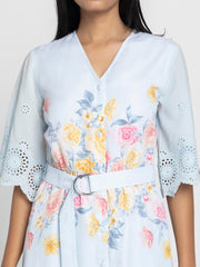 Close-up of floral print and Schiffli embroidery at hem on light blue Poetry cotton dress