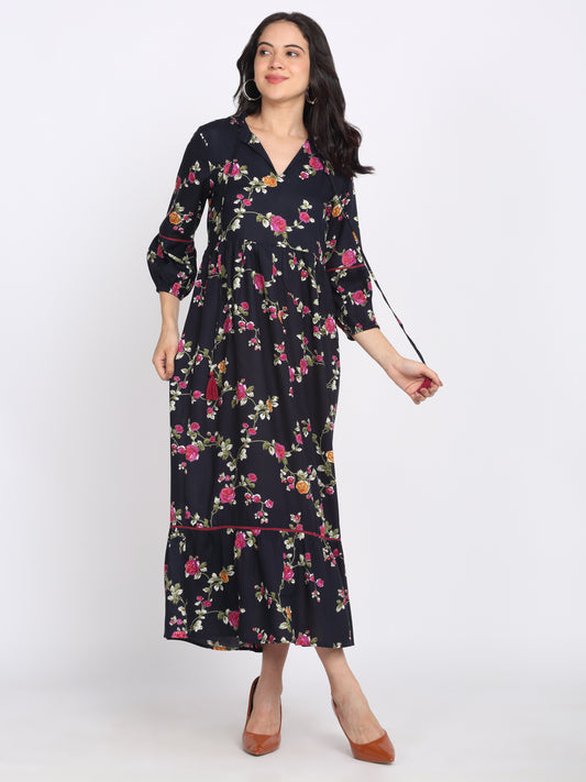 Navy blue floral print rayon dress with round neck slit, three-quarter sleeves, lace insert at sleeves, tie up at neckline, lace detailed gathered hem, relaxed fit front view
