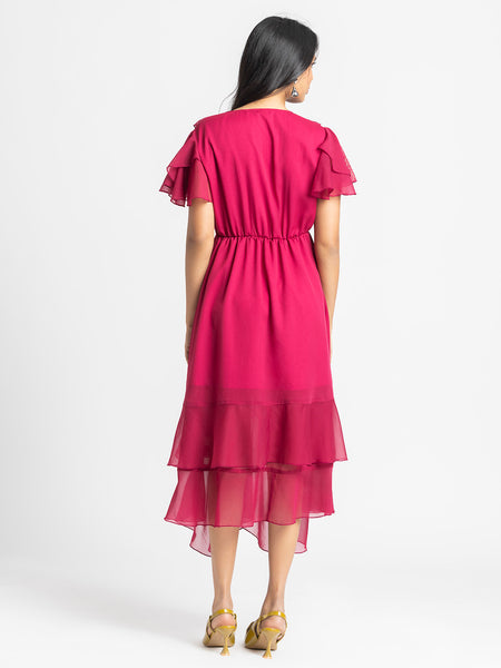Rear view of Sebastina Dress highlighting soft chiffon relaxed fit short flared sleeves and layered asymmetric hem