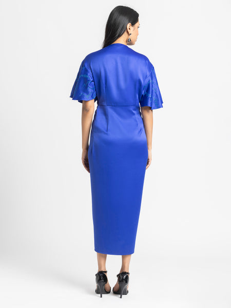 Back view blue satin dress, straight hem, relaxed fit, fluid satin, shows sleeve and body shape