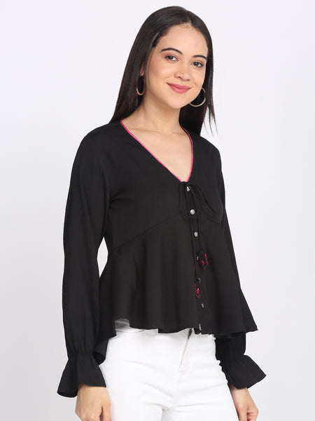 Side view of black peplum crinkled crepe top full sleeves asymmetric hem tie with embroidered tassels