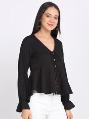 Side view of black peplum crinkled crepe top full sleeves asymmetric hem tie with embroidered tassels