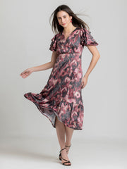 Shaye dusty pink floral print party dress satin flutter sleeves overlap detail movement shot for women