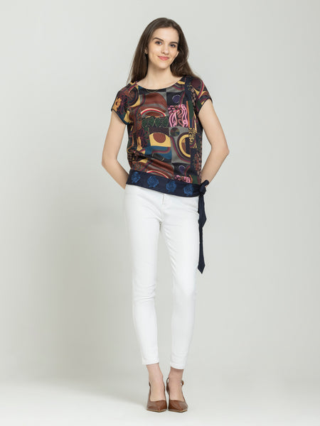 Shaye navy blue printed party top modal satin styled with white pants for women complete look