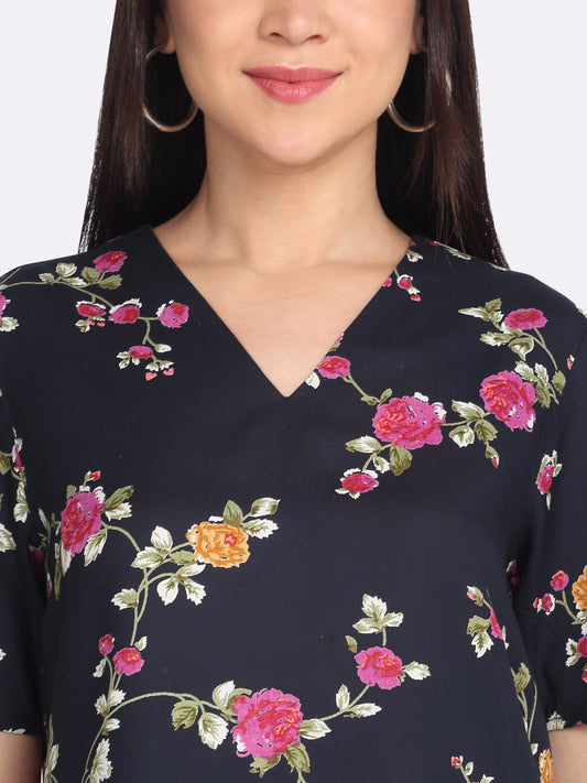 Close-up of v-neckline and floral print on navy viscose rayon Kairo top short sleeves for women