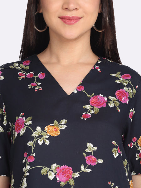 Close-up of v-neckline and floral print on navy viscose rayon Kairo top short sleeves for women