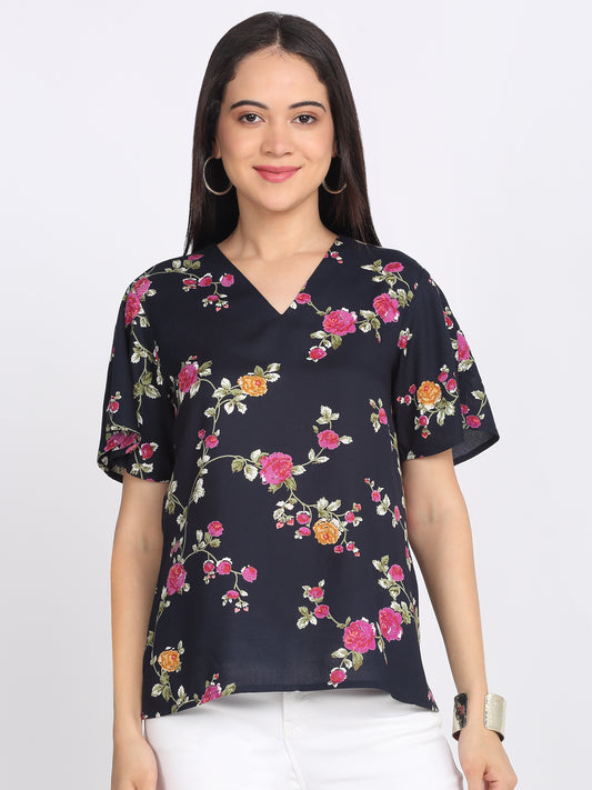 Navy blue floral print viscose rayon top v-neckline short flared sleeves keyhole back side slits curved hem relaxed fit front view