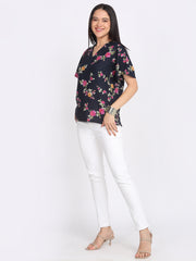 Navy blue Kairo top floral print v-neck short flared sleeves curved hem lifestyle model walking pose