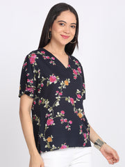 Side view Kairo top navy blue floral print v-neckline flared sleeves curved hem relaxed fit