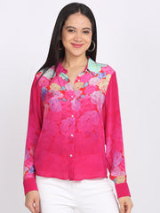 Pink floral print sheer shirt with shirt collar, long sleeves, white pants, and button-down front—main front pose