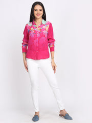 Model in pink floral print button-down shirt, shirt collar, paired with straight white pants—full-body view