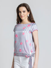 Shaye white floral print satin top styled with white pants relaxed fit for women
