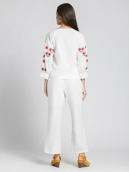 Rear view of Sojourn Co-ord Set showcasing embroidery on sleeves, side zipper on pants, and relaxed fit
