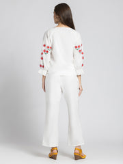 Rear view of Sojourn Co-ord Set showcasing embroidery on sleeves, side zipper on pants, and relaxed fit