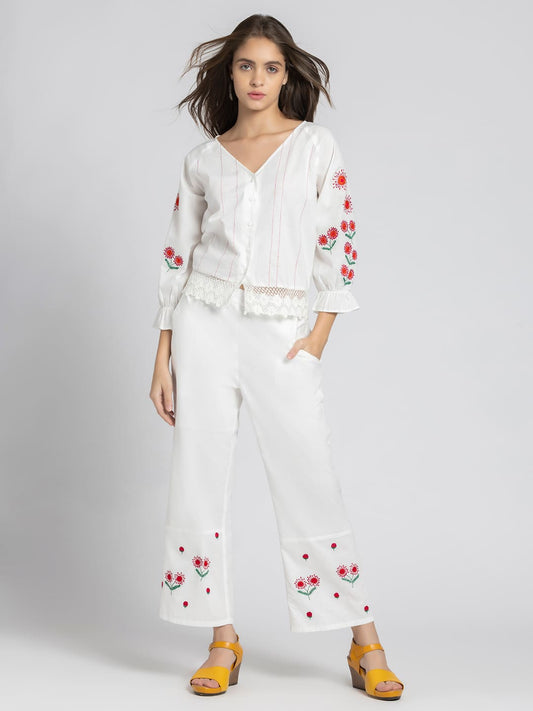 Model wearing white embroidered Sojourn Co-ord Set with crop top V-neck three-quarter elasticated sleeves and scallop hem