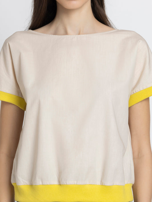 Front view of Sullivan Top showing boat neck beige cotton fabric rib detailing at hem and sleeves relaxed fit