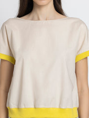 Front view of Sullivan Top showing boat neck beige cotton fabric rib detailing at hem and sleeves relaxed fit