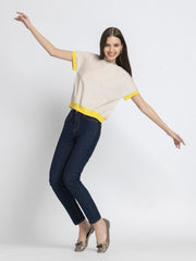 Model jumping in Sullivan Top and jeans highlighting ultra soft breathable cotton and straight hem
