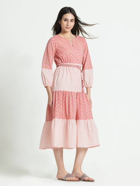Side view of pink cotton Sunday dress showing regular fit and straight hem