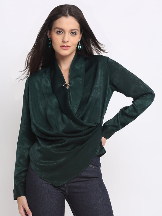 Model wearing midnight blue Vega Top with round neck cap sleeves and front tie waist detail