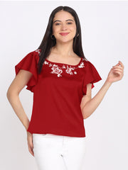 Maroon satin top with square neck, white floral embroidery on neckline, short flared sleeves, curved hem, relaxed fit front view