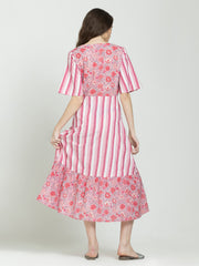 Back view of pink fit and flare cotton dress with floral print skirt, straight hem, concealed zipper