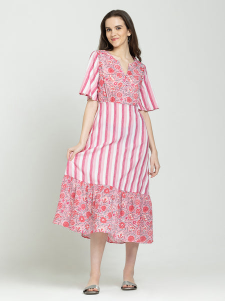 Pink cotton V-neck floral dress with short flared sleeves, straight hem, worn relaxed