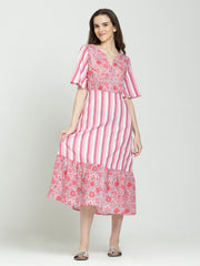 Pink cotton V-neck floral dress with short flared sleeves, straight hem, worn relaxed